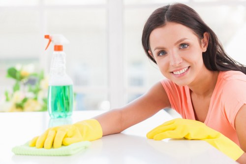 Technician preparing carpet cleaning equipment in a home setting