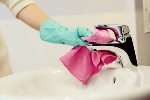Office cleaning team working in a modern SW7 workspace
